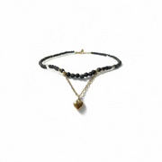 Elegant black beaded neckpiece with golden heart charm